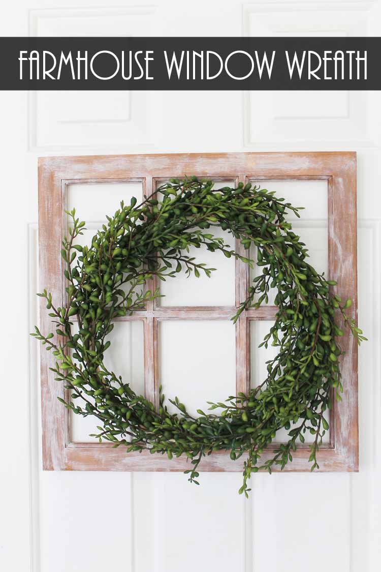 green wreath on a rustic window