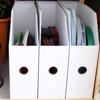 Learn about kitchen cabinet accessories that help you to store all of those pesky lids for plastic bowls! This quick and easy DIY organization project is the perfect way to organize your cabinets!