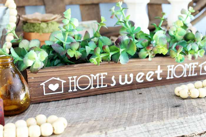 wooden box centerpiece with greenery