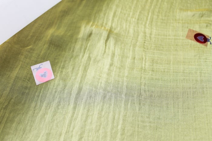 adding ladybugs stickers to silk scarf