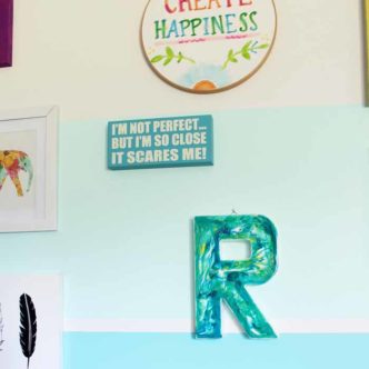 Make a marbling craft with epoxy resin! This fun monogram is perfect for a kids or teen room and is easy to make!