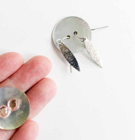 earrings in a button for packing