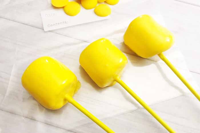 Marshmallows with yellow candy melts added