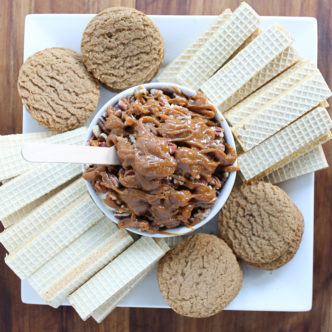 Cheesecake dip with salted caramel and pecans - makes a delicious fall dessert when served with pumpkin spice and apple crisp wafers from Voortman Bakery! #pumpkinspice #cheesecake #dessert