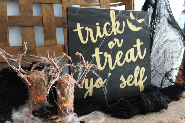 gold and black halloween sign