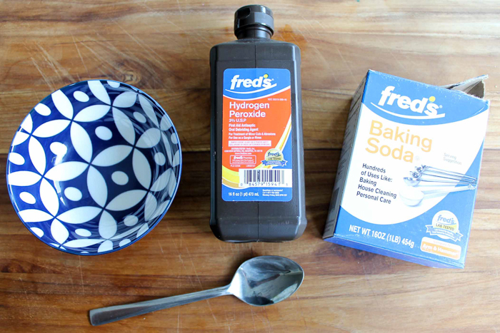 ingredients for grout cleaner on a cutting board