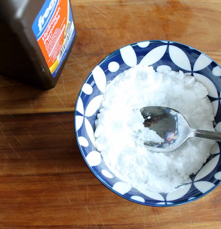 mixing grout cleaner in a bowl