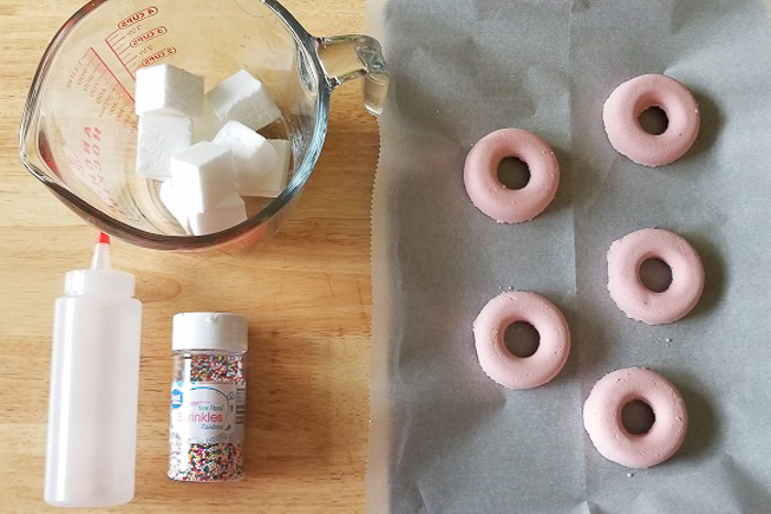 donut shaped bath bombs on a table