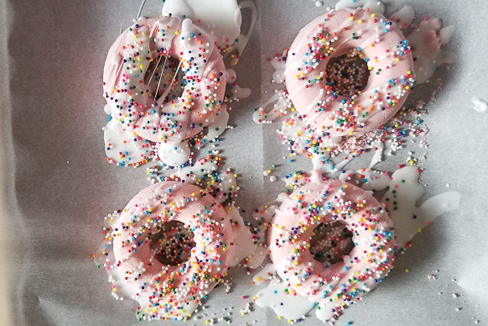 bath bombs that look like pink donuts with sprinkles