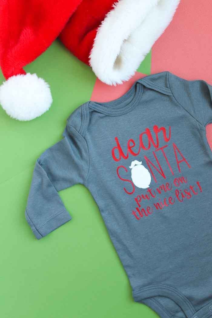 Making a baby Christmas onesie for your little one with the Cricut! A quick and easy Santa onesie with the cut file for you to make at home! #cricut #cricutmade
