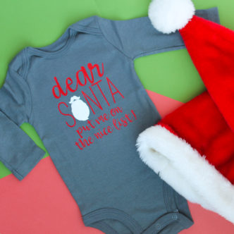 Making a baby Christmas onesie for your little one with the Cricut! A quick and easy Santa onesie with the cut file for you to make at home! #cricut #cricutmade