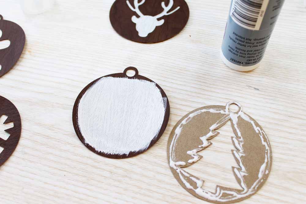 Gluing handmade ornaments together.