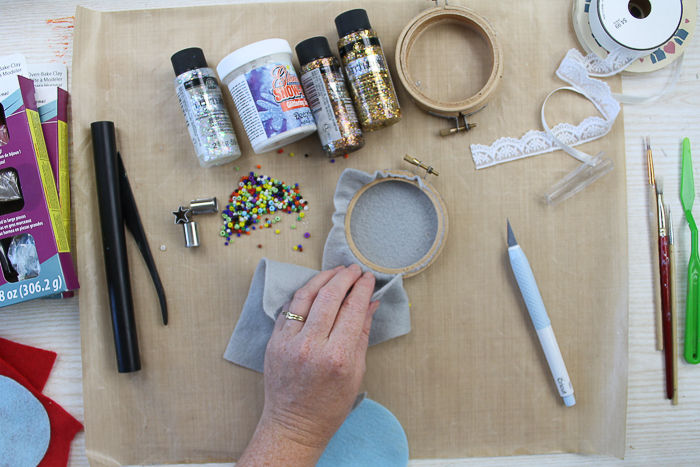 Adding felt to an embroidery hoop to make a Christmas ornament