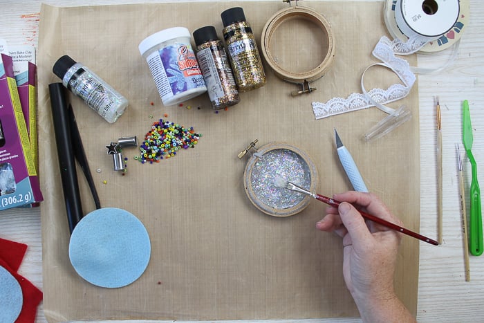 Adding Glitterific paint to a Christmas ornament