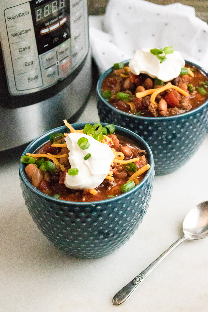 A bowl of chili on a table