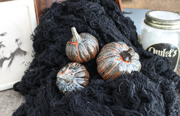 pile of pumpkins covered in resin