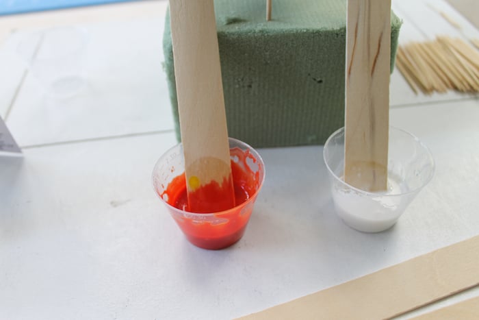 Mixing epoxy resin for marbled pumpkins.