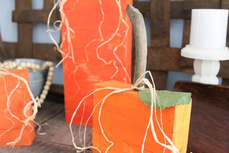 driftwood stems on rustic wood pumpkins 