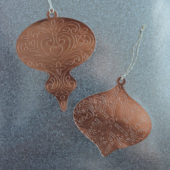 Make these paper Christmas ornaments with your Cricut machine and add them to your tree! Embossed details are easy to make with the scoring wheel! #cricut #cricutmade