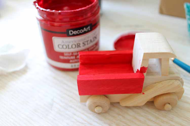 staining a wood truck red