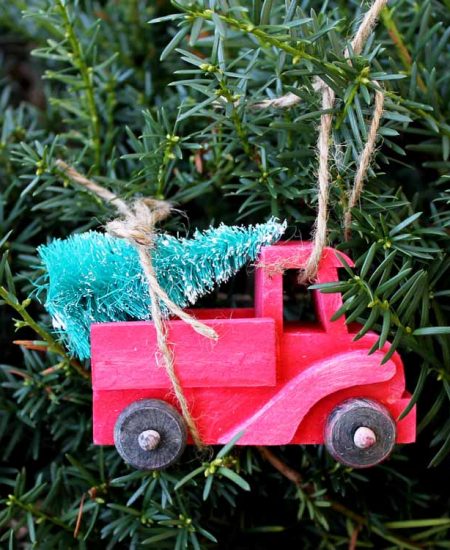 red truck with christmas tree ornament