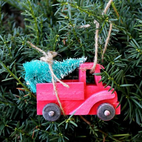 red truck with christmas tree ornament