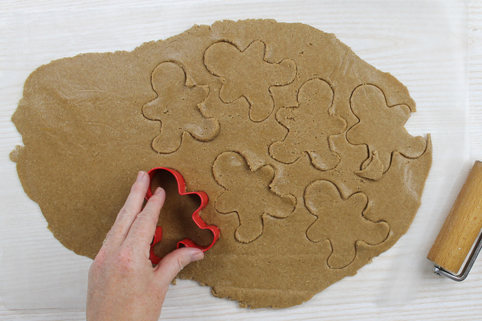 cutting gingerbread cookies