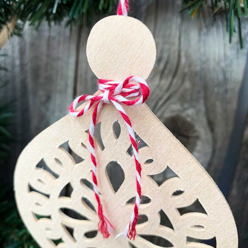basswood ornament cut on a cricut