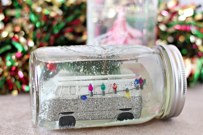 mason jar with water and glitter for snow globe
