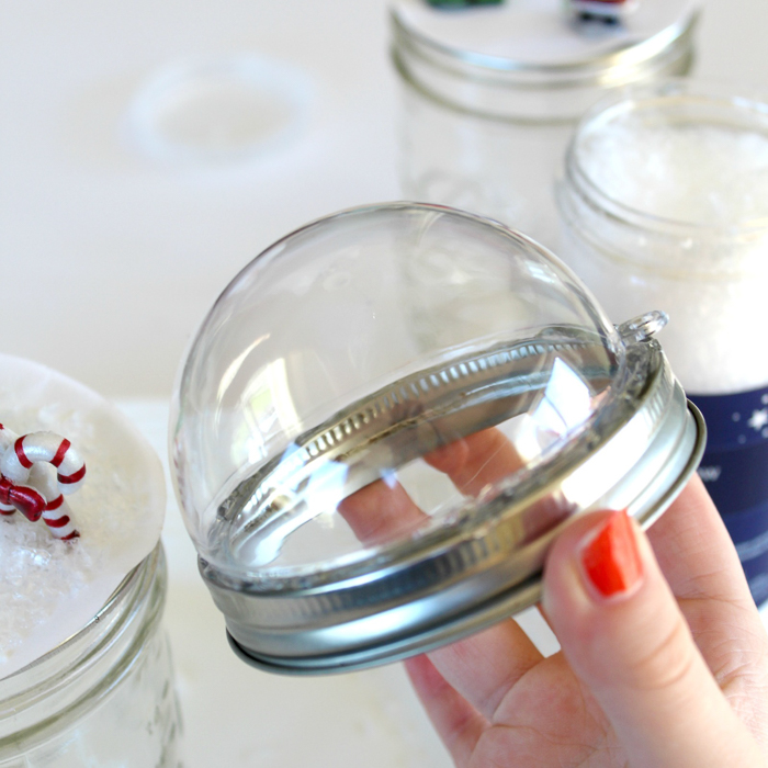 snow globe topper process photo of adding the globe to the lid