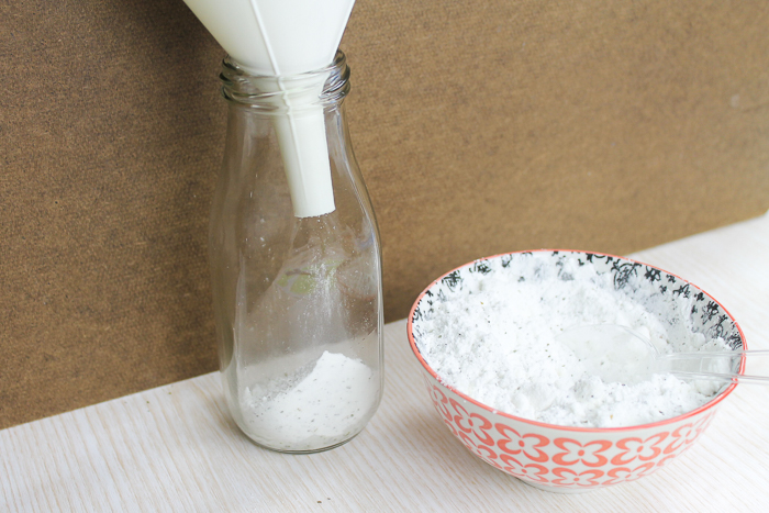 adding milk bath to glass jar