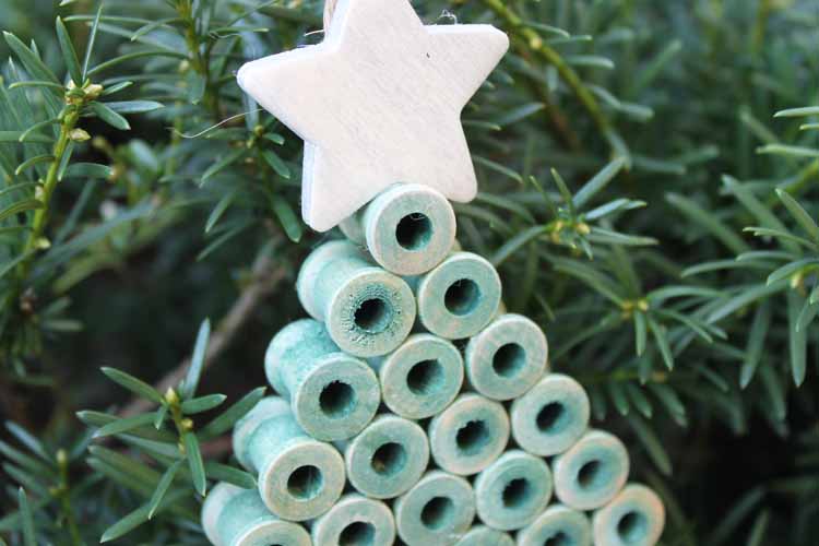 wooden spools stacked to make an ornament