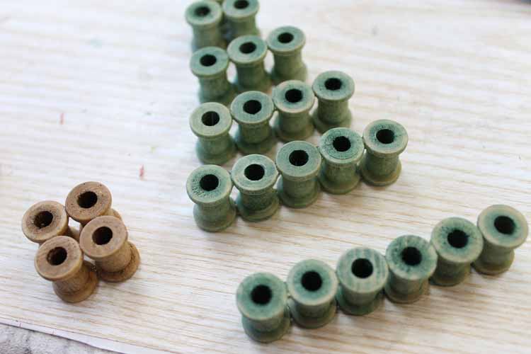 wooden spools glued in rows