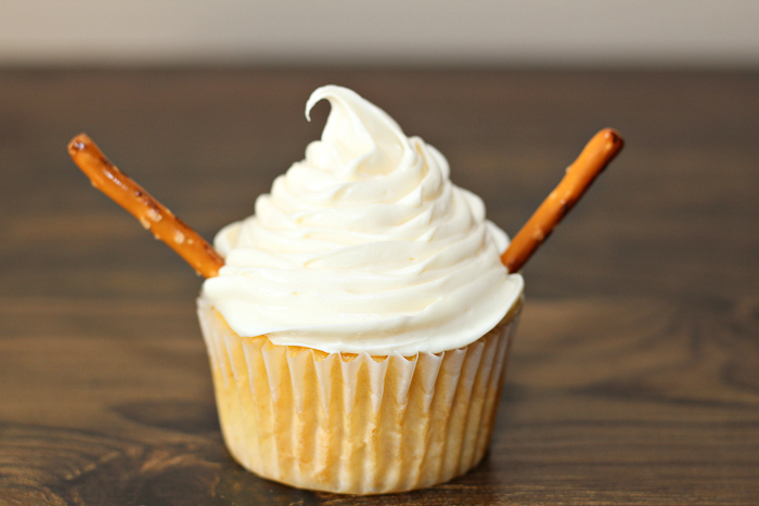 pretzel arms on a snowman cupcake