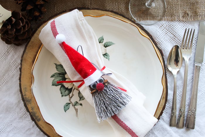 broom santa on a Christmas tablescape