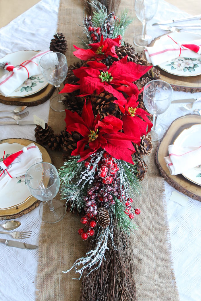 poinsettia and pine cone christmas centerpiece