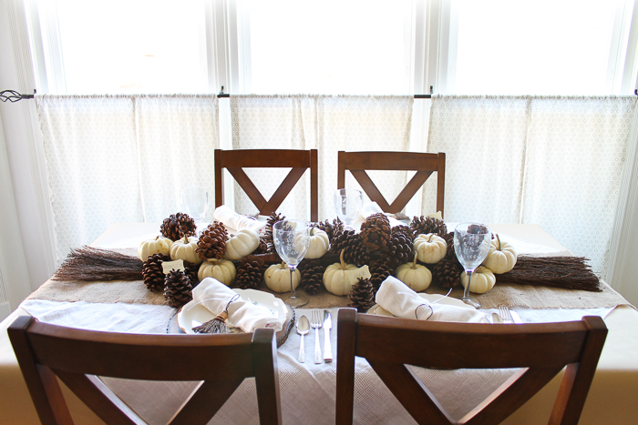 A dining room table in front of a window