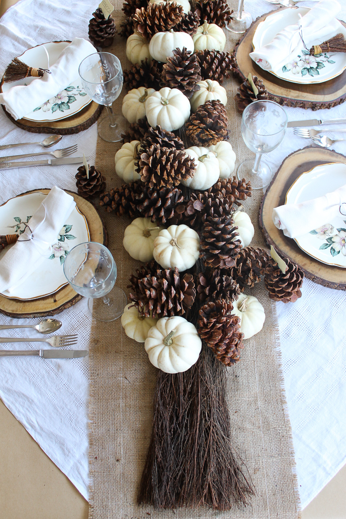 pinecones and pumpkins on a fall table