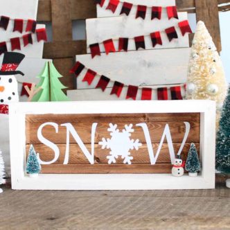 Make these reversible wooden signs with sayings! This one has winter on one side and Valentine's Day on the back. Use this same technique to make any wooden sign you want! #cricut #cricutmade
