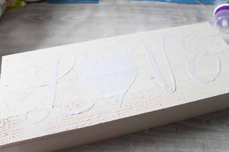 Adding cricut vinyl to wood sign