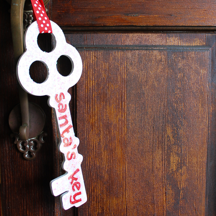 white santa's magic key on wood door