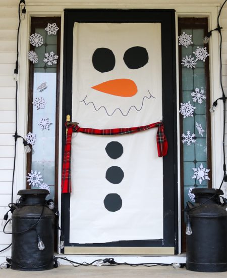 Make these snowman door decorations in just minutes then add color changing lights! The same decoration will work for Christmas and winter! #snowman #christmas #winter