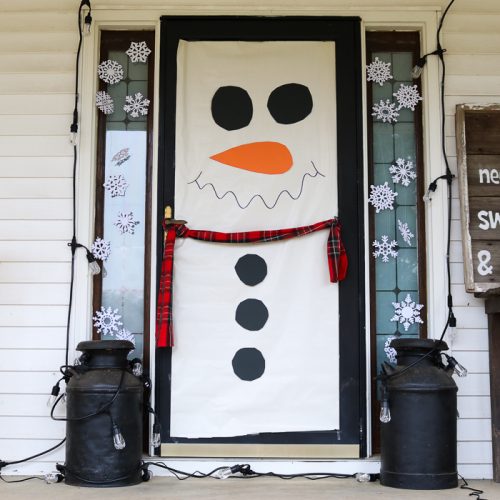Make these snowman door decorations in just minutes then add color changing lights! The same decoration will work for Christmas and winter! #snowman #christmas #winter