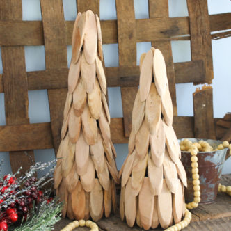 Make a wooden Christmas tree in just minutes with the simple DIY instructions in this post! A quick and easy way to add some rustic farmhouse style charm to your holiday decor! #christmas #rustic #farmhousestyle