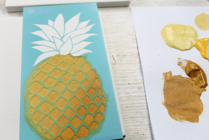 Painting on tile to make ceramic trivets.