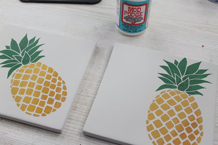 Using dishwasher safe mod podge on painted tile trivets.