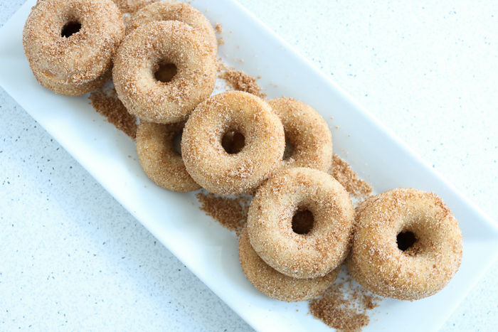 A doughnut sitting next to a donut