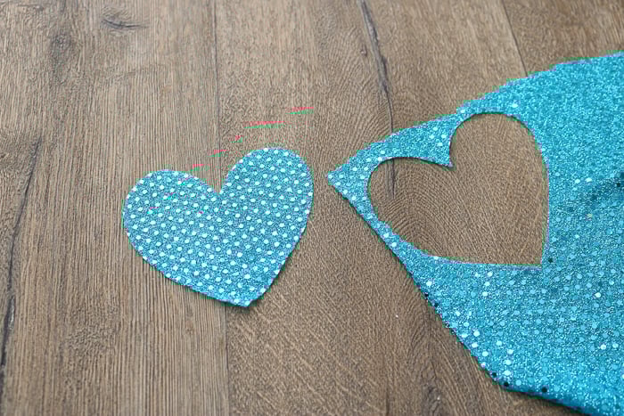 Cutting sequin fabric.