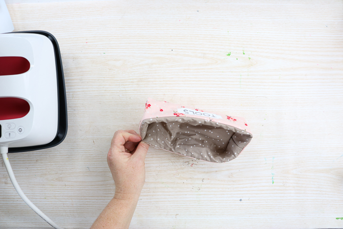 Final sewing step when making fabric storage bins with your Cricut.