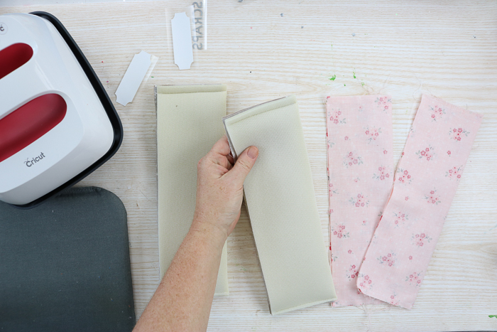 Folding fabric with batting when creating fabric storage baskets.